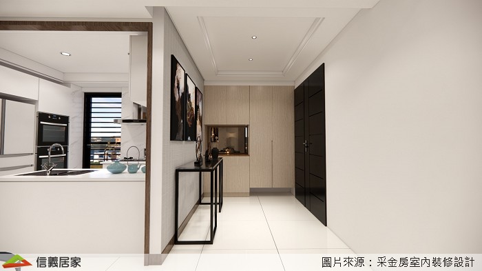 入門玄關處以灰牆做為空間開場及動線引導,並利用門後畸零空間設計整面鞋櫃及儲藏間,避免坪數浪費,提高收納機能。